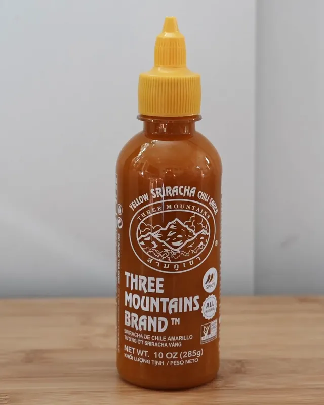 Three Mountains Brand Yellow Sriracha bottle